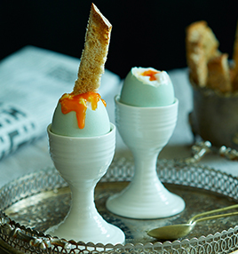 runny soft boiled egg with dippy soldiers