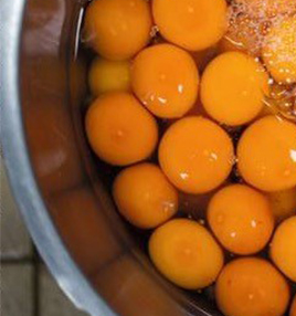 lots of raw egg yolks in pan