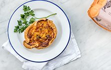 Burford Brown Mushroom Quiche on white plate with decorative parsley