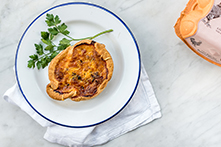 Burford Brown Mushroom Quiche on white plate with decorative parsley