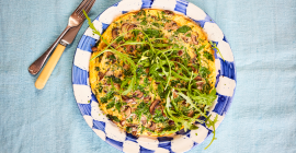 Mushroom and Clarence Court egg frittata topped with rocket, made by Alice Liveing.