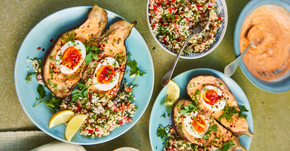 Baked aubergine with softly boiled eggs, chilli tahini yoghurt and herby tabbouleh Clarence