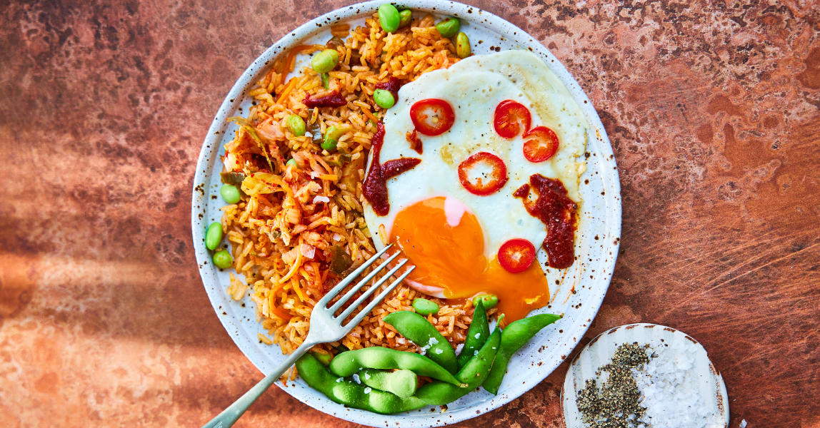 Kimchi fried rice with chillis and a golden yolked Clarence Court egg.