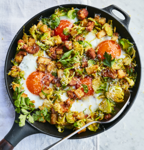 Aerial shot of potato and egg hash on a light blue pastel background