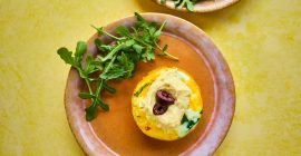 Mini egg muffins with houmous and olives