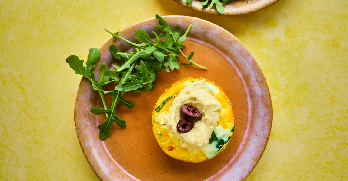 Mini egg muffins with houmous and olives