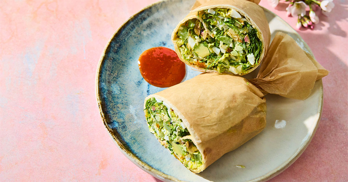 Protein wrap with chopped avocado, egg, Dr Wills avocado mayo and buffalo sauce